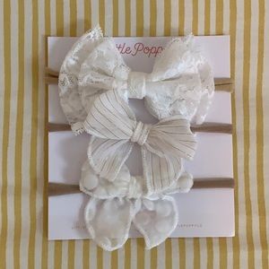 Assorted white infant bows